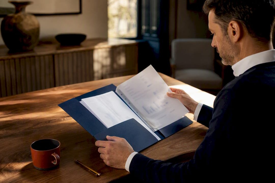 Entrepreneur reviewing an ATOL application folder